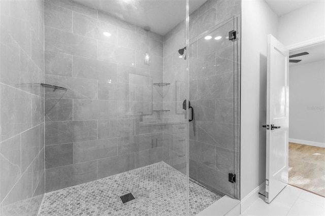 8112 N 10th St, Tampa, FL 33604 - full bath with a stall shower, baseboards, and tile patterned flooring