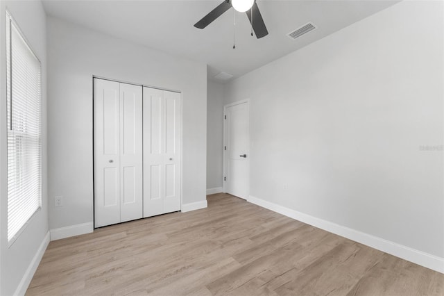 8112 N 10th St, Tampa, FL 33604 - unfurnished bedroom with light wood finished floors, baseboards, and a closet