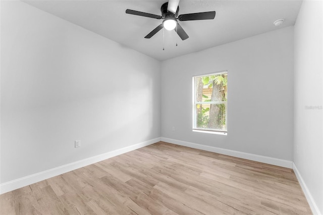 8112 N 10th St, Tampa, FL 33604 - empty room featuring light wood-style floors, baseboards, a ceiling fan, and a smoke detector