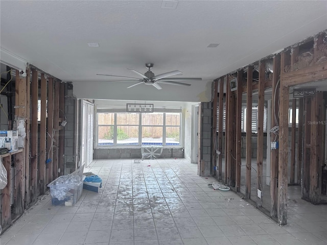 709 Pruitt Dr, Madeira Beach, FL 33708 - unfurnished living room with ceiling fan