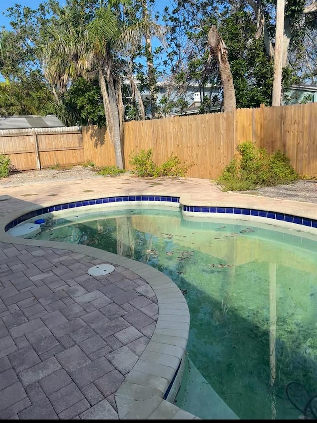 709 Pruitt Dr, Madeira Beach, FL 33708 - view of swimming pool featuring a fenced backyard