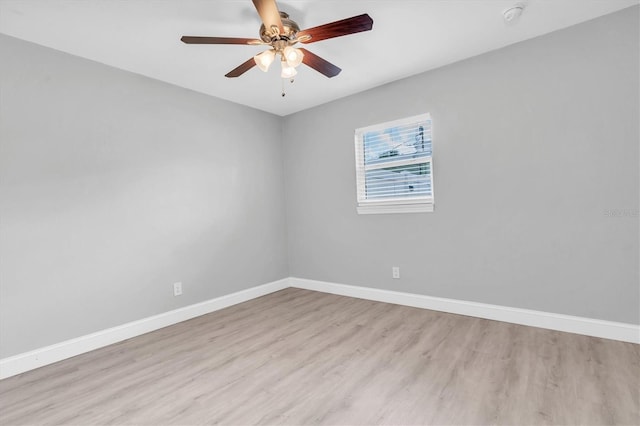 5685 35th Ave N, Saint Petersburg, FL 33710 - empty room with light wood-type flooring, baseboards, a ceiling fan, and a smoke detector