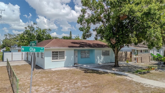 8525 N Ola Ave, Tampa, FL 33604 - view of front of property with stucco siding and roof with shingles