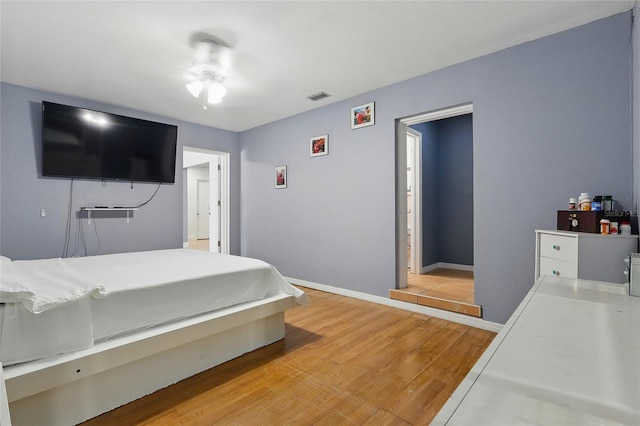 8525 N Ola Ave, Tampa, FL 33604 - bedroom with light wood finished floors and baseboards