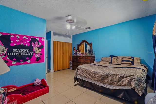 8525 N Ola Ave, Tampa, FL 33604 - tiled bedroom with a textured ceiling and ceiling fan