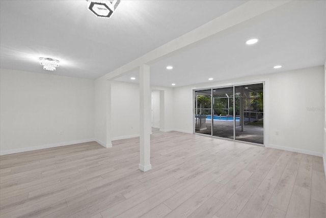 15025 Shark St, Hudson, FL 34667 - basement with wood finished floors, baseboards, and recessed lighting