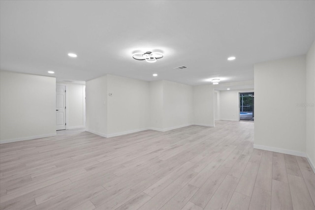 15025 Shark St, Hudson, FL 34667 - empty room with light wood-type flooring, recessed lighting, and baseboards