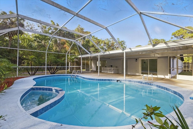 15025 Shark St, Hudson, FL 34667 - view of pool with a patio area, a pool with connected hot tub, and glass enclosure