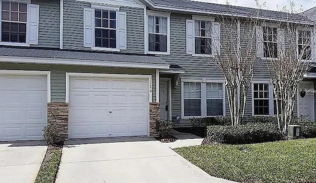13290 Thoroughbred Loop, Largo, FL 33773 - view of front of home featuring driveway and an attached garage
