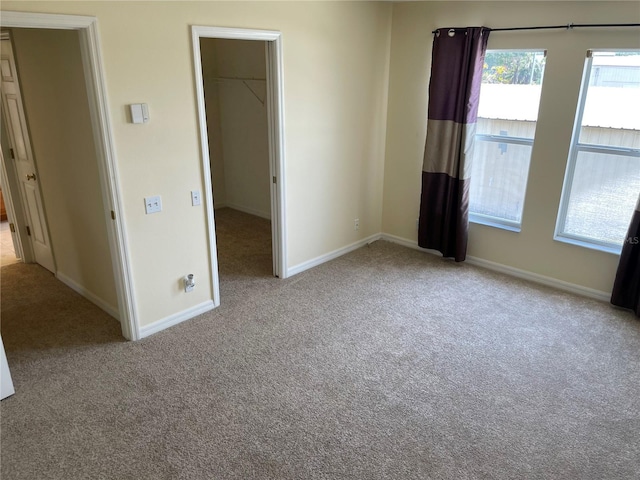 13290 Thoroughbred Loop, Largo, FL 33773 - unfurnished bedroom with carpet floors, a walk in closet, and a closet