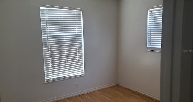 2603 Mary Sue St SW, Largo, FL 33774 - unfurnished room featuring wood finished floors and baseboards