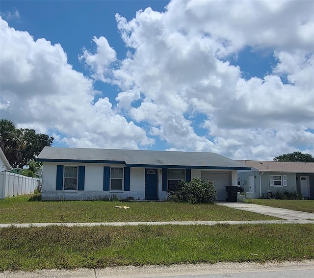2603 Mary Sue St SW, Largo, FL 33774 - ranch-style home with a garage, stucco siding, and driveway