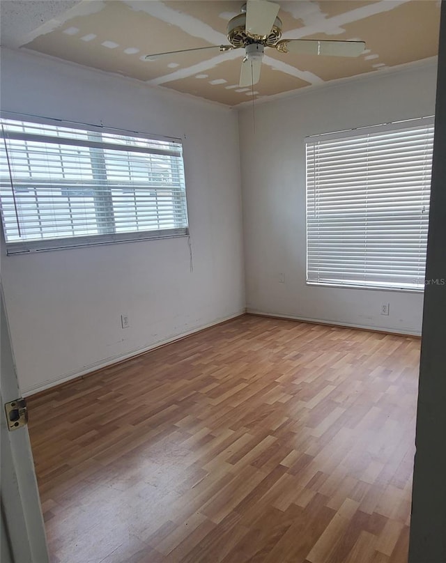 2603 Mary Sue St SW, Largo, FL 33774 - empty room featuring a ceiling fan and wood finished floors