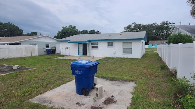 2603 Mary Sue St SW, Largo, FL 33774 - back of house featuring stucco siding