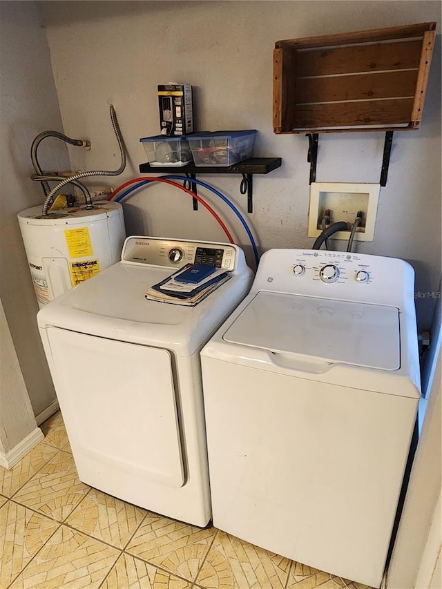 11107 Riverview Dr, Riverview, FL 33578 - washroom with washer and clothes dryer, water heater, and light tile patterned flooring