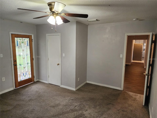 11107 Riverview Dr, Riverview, FL 33578 - carpeted spare room featuring ceiling fan, a textured ceiling, and a smoke detector