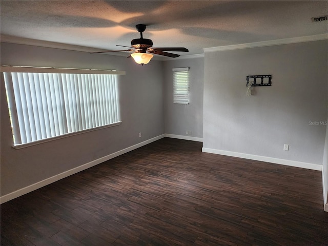 11107 Riverview Dr, Riverview, FL 33578 - spare room with ceiling fan, dark wood finished floors, crown molding, and a textured ceiling