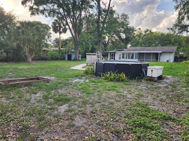 11107 Riverview Dr, Riverview, FL 33578 - view of grassy yard with an outdoor pool