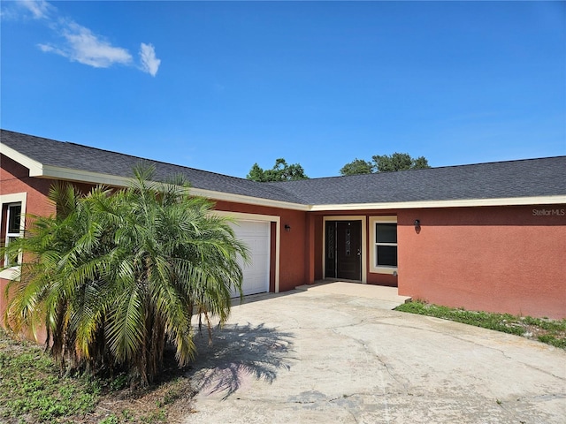 11210 Mcmullen Rd, Riverview, FL 33569 - view of front of house with a garage, driveway, and stucco siding