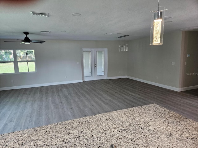 11210 Mcmullen Rd, Riverview, FL 33569 - unfurnished room with wood finished floors, a ceiling fan, and a textured ceiling