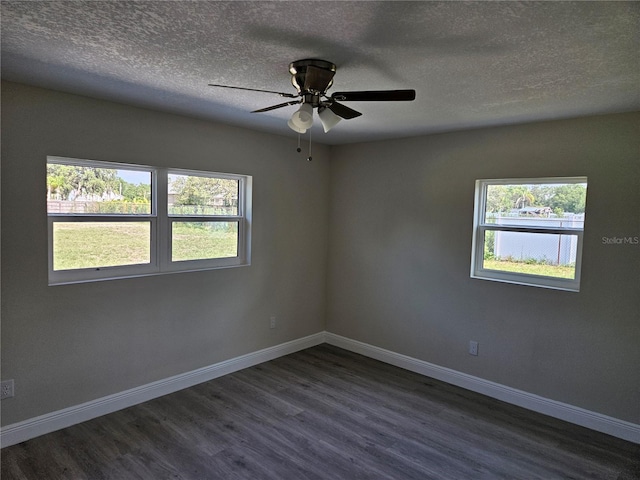 11210 Mcmullen Rd, Riverview, FL 33569 - unfurnished room with dark wood-style flooring, healthy amount of natural light, a textured ceiling, and ceiling fan