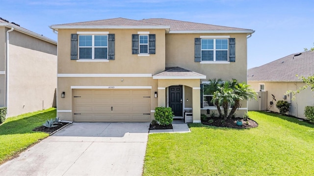 30989 Summer Sun Loop, Wesley Chapel, FL 33545 - townhome / multi-family property with stucco siding, concrete driveway, a garage, and roof with shingles