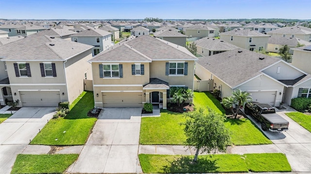 30989 Summer Sun Loop, Wesley Chapel, FL 33545 - traditional-style house with concrete driveway and a residential view