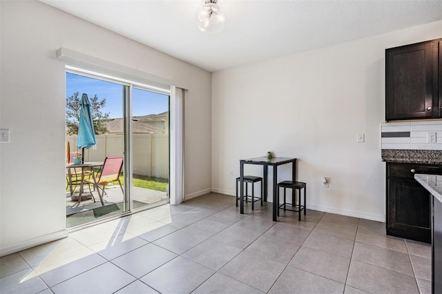 30989 Summer Sun Loop, Wesley Chapel, FL 33545 - dining room with light tile patterned floors and baseboards