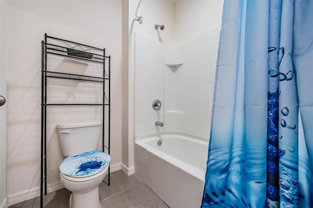 30989 Summer Sun Loop, Wesley Chapel, FL 33545 - bathroom featuring shower / bath combo with shower curtain, toilet, tile patterned floors, and baseboards