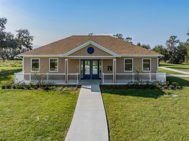 30989 Summer Sun Loop, Wesley Chapel, FL 33545 - view of front of house featuring a porch, a front yard, and roof with shingles