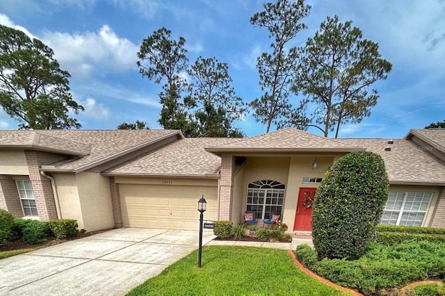 18531 Bent Pine Dr, Hudson, FL 34667 - ranch-style house with an attached garage, roof with shingles, and brick siding