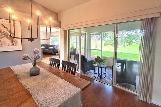 18531 Bent Pine Dr, Hudson, FL 34667 - dining area featuring wood finished floors and lofted ceiling