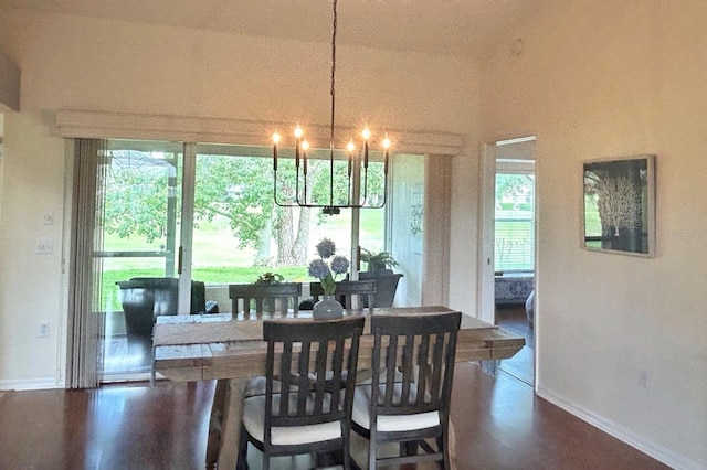 18531 Bent Pine Dr, Hudson, FL 34667 - dining room featuring a chandelier, baseboards, and plenty of natural light