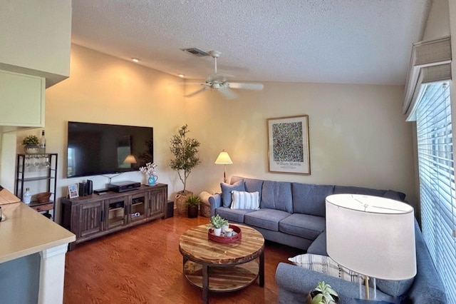 18531 Bent Pine Dr, Hudson, FL 34667 - living room with a textured ceiling, a ceiling fan, wood finished floors, and lofted ceiling