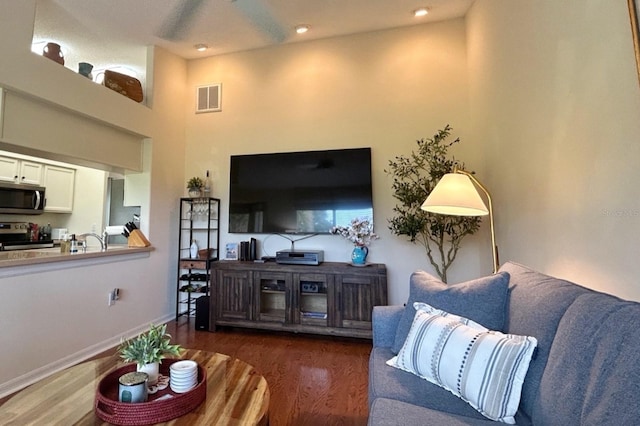 18531 Bent Pine Dr, Hudson, FL 34667 - living room with wood finished floors, recessed lighting, a towering ceiling, and baseboards