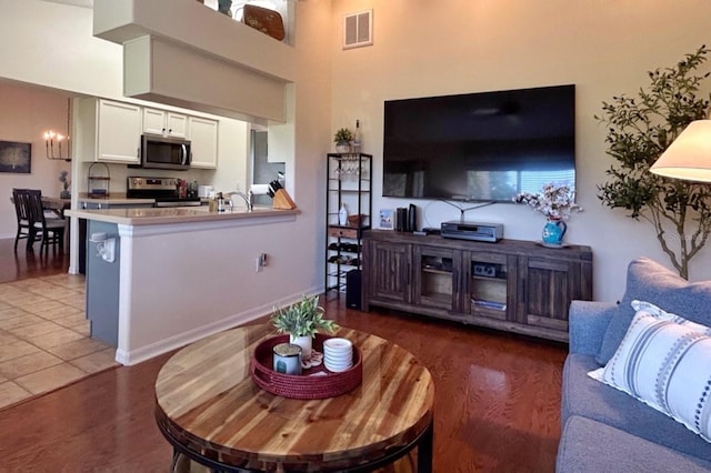 18531 Bent Pine Dr, Hudson, FL 34667 - living room featuring wood finished floors and a high ceiling