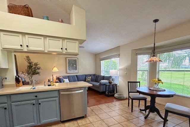 18531 Bent Pine Dr, Hudson, FL 34667 - kitchen featuring dishwasher, a sink, a peninsula, gray cabinetry, and open floor plan