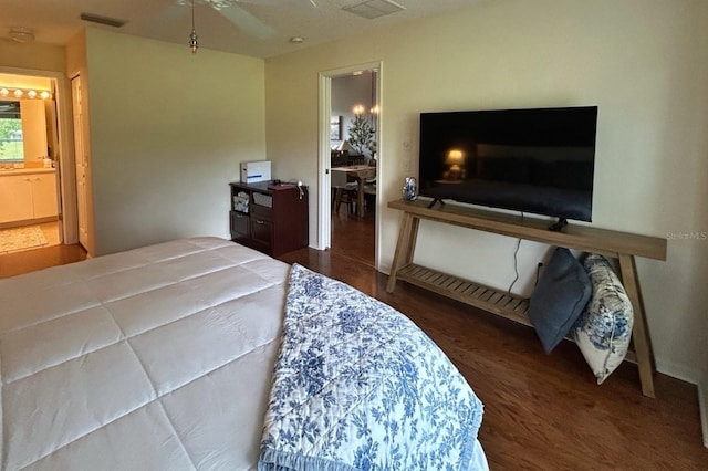 18531 Bent Pine Dr, Hudson, FL 34667 - bedroom with wood finished floors and ensuite bathroom