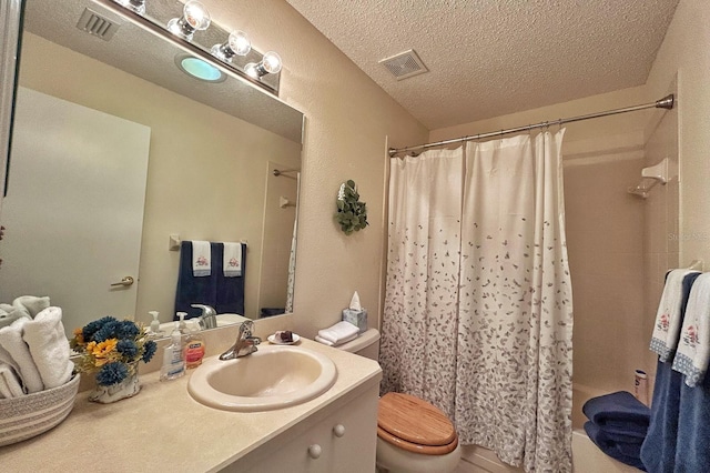 18531 Bent Pine Dr, Hudson, FL 34667 - full bath with a textured ceiling, vanity, toilet, and shower / tub combo