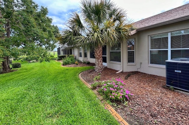 18531 Bent Pine Dr, Hudson, FL 34667 - view of grassy yard featuring central AC