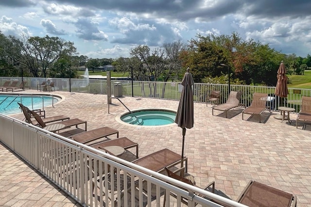 18531 Bent Pine Dr, Hudson, FL 34667 - community pool with a patio area, a community hot tub, and view of wooded area
