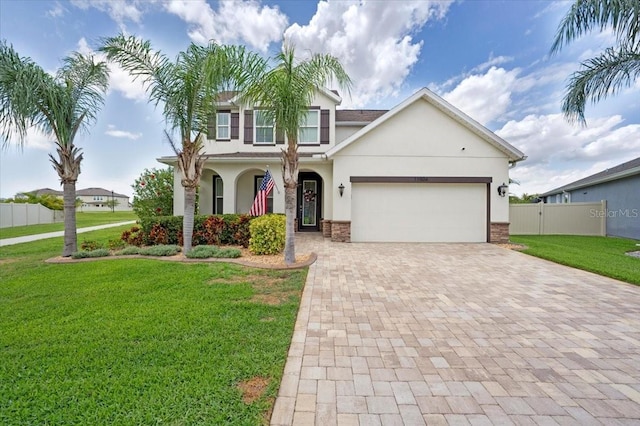 11904 Greenchop Pl, Riverview, FL 33579 - traditional-style house with stucco siding, decorative driveway, a garage, and a porch