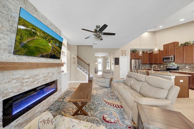11904 Greenchop Pl, Riverview, FL 33579 - living area featuring a fireplace, light tile patterned floors, ceiling fan, stairway, and recessed lighting
