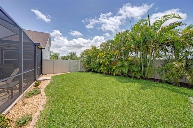 11904 Greenchop Pl, Riverview, FL 33579 - view of yard featuring a gate and glass enclosure