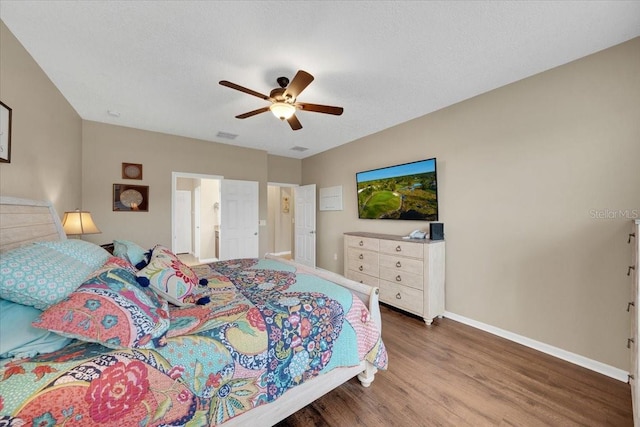 11904 Greenchop Pl, Riverview, FL 33579 - bedroom with wood finished floors, baseboards, and ceiling fan