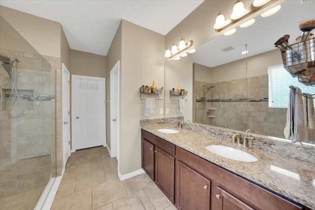 11904 Greenchop Pl, Riverview, FL 33579 - full bath with tiled shower, double vanity, tile patterned flooring, and baseboards