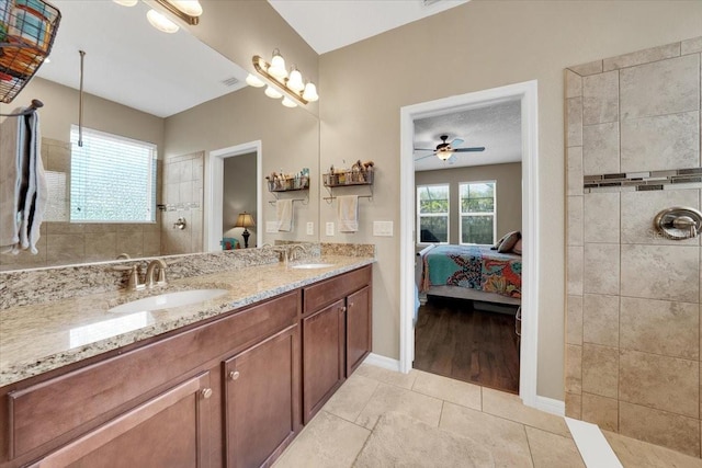 11904 Greenchop Pl, Riverview, FL 33579 - bathroom with connected bathroom, double vanity, baseboards, tile patterned floors, and a ceiling fan