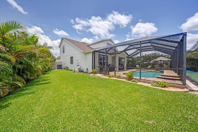 11904 Greenchop Pl, Riverview, FL 33579 - rear view of property with a lawn, an outdoor pool, a patio, stucco siding, and a lanai