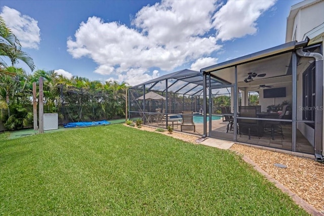 11904 Greenchop Pl, Riverview, FL 33579 - view of green lawn with an outdoor pool, a patio, ceiling fan, and glass enclosure