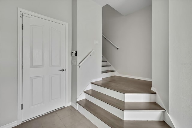 1402 Harbour Walk Rd, Tampa, FL 33602 - stairway featuring tile patterned flooring and baseboards